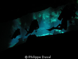 Shadow. The shadow of divers in cenote Chacmool by Philippe Duval 